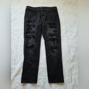 AMIRI Black Ripped Skinny Jeans with Shredded Knee Panels